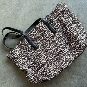 Woman’s cheetah purse or overnight bag